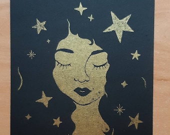 Starry hair - Gocco print, illustration in golden on black cardboard.