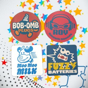 May include: Four colorful circular and square designs with text. The top left is a red circle with the words "BOB-OMB PLUGS". The top right is a red circle with the words "ROY Smooth Sounds". The bottom left is a white square with a cow and the words "Moo Moo MILK". The bottom right is a blue square with the words "FUZZY BATTERIES".