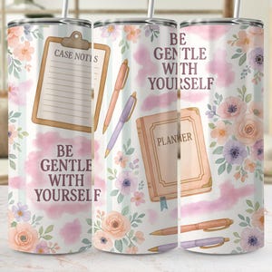 May include: A cylindrical tumbler featuring a white background with pastel floral patterns, a clipboard labelled CASE NOTES, a planner, and pens. The text BE GENTLE WITH YOURSELF is printed in dark purple. The tumbler includes a metal straw.