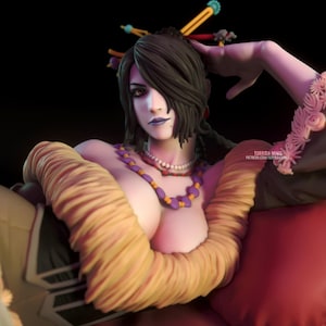 May include: A detailed figurine of a woman with dark hair and makeup, adorned with jewelry and a yellow wrap. The figure is posed in a relaxed position, with a red pillow in the background. The text "TORRIDA MINIS" is visible.
