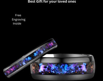 May include: Two black tungsten carbide rings featuring a central inlay of iridescent blue and purple crushed material. Text on the image reads: Guarenteed Genuine Tungsten Carbide Ring, Best Gift for your loved ones, Free Engraving Inside.