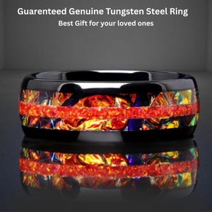 May include: A black tungsten steel ring with a vibrant, multi-colored inlay of red, orange, yellow, and blue. The ring has a glossy finish and the text "Guaranteed Genuine Tungsten Steel Ring Best Gift for your loved ones".