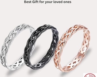 May include: Three rings with a braided pattern in silver, black, and rose gold tones. The text above reads Guarenteed Genuine 925 Silver Ring Best Gift for your loved ones. A small circular stamp in the corner reads Real Sterling 925 Silver.
