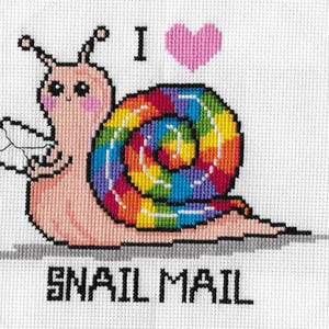 May include: Cross-stitch art featuring a cartoon snail with a rainbow shell, holding a letter. Above the snail is a pink heart and the word "I". Below the snail is the text "SNAIL MAIL".