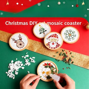 May include: A set of Christmas DIY mosaic coasters featuring festive designs such as a reindeer, Christmas tree, Santa Claus, and snowflake. The coasters are made of mosaic tiles and wood, with the text "Christmas DIY mosaic coaster".