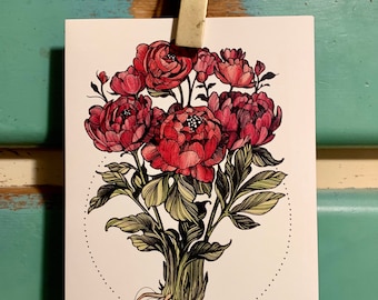 May include: A botanical illustration of a bouquet of red peonies with green and yellow leaves and roots. The artwork is on a white card, held by a wooden clothespin against a teal and wood-toned background.