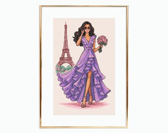 May include: A framed illustration of a woman in a flowing purple dress, holding a bouquet of pink flowers. The Eiffel Tower is in the background. The artwork is in a cross-stitch style, with a gold frame.
