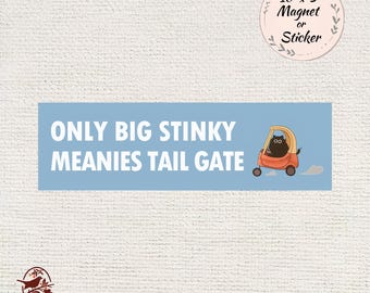 May include: A light blue rectangular magnet or sticker with the text "ONLY BIG STINKY MEANIES TAIL GATE" in white. A cartoon cat drives a small orange car. The magnet is 10 inches by 3 inches.