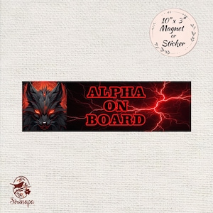 May include: A rectangular magnet or sticker with the text "ALPHA ON BOARD" in red, accompanied by a black and red wolf illustration. The design includes a red lightning effect and is approximately 10" x 3".