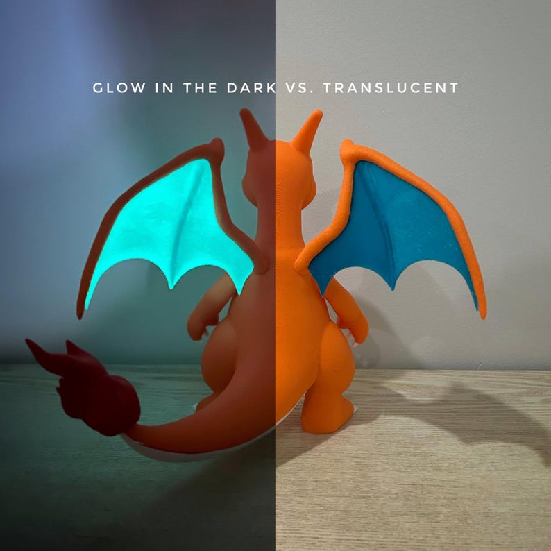 Shiny Charizard glowing teal flames next to a regular Charizard