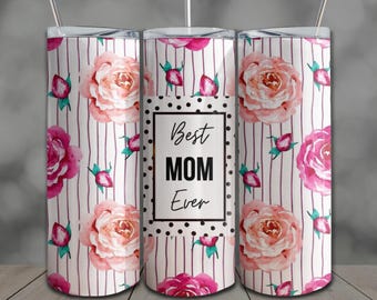 May include: A floral tumbler with a white background and vertical stripes. The design features pink roses and the text "Best MOM Ever" in a black frame. Includes a silver straw.