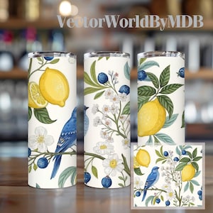 May include: Three white insulated tumblers with a botanical design featuring lemons, blueberries, white flowers, and a blue bird. The tumblers are cylindrical and have a silver rim. A matching square design is also visible.