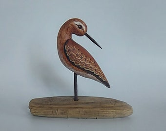 hand sculpted hand painted polymer clay decorative shorebird on driftwood