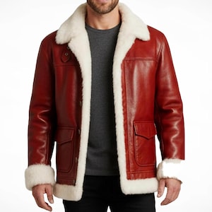 May include: A red leather jacket with a white shearling collar and lining. The jacket has two front pockets and shearling cuffs. The jacket is a classic style, suitable for cold weather.