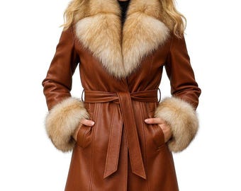 May include: A brown leather coat with a fur collar and cuffs. The coat has a belted waist and pockets. The fur is a light brown color. The coat is knee-length.