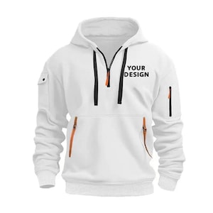 Personalised Logo Hoodies, Custom Logo Hoodie, Company Merch Jumpers, Custom Workwear Gift for Worker, Uniform Hoodie, Gift for Dad. May include: White hooded sweatshirt with a front zipper, black drawstrings, and orange accents. Features a kangaroo pocket and a small pocket on the left sleeve. The text "YOUR DESIGN" is printed on the chest.