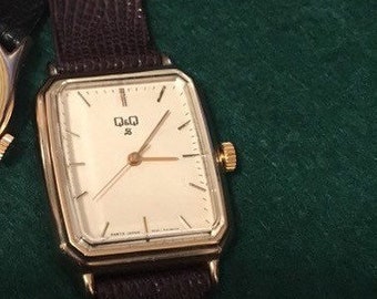 Q&Q unisex watch, needs work, unknown if can be fixed