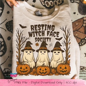 May include: Beige sweatshirt with the text "RESTING WITCH FACE SOCIETY" and a graphic of three ghosts wearing witch hats, with pumpkins and bats. A digital download file.