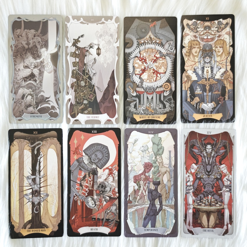 May include: Eight tarot cards arranged in two rows, featuring Strength, The Hermit, Wheel of Fortune, Justice, The Hanged Man, Death, Temperance, and The Devil. Each card displays intricate, detailed illustrations with unique color palettes and text.