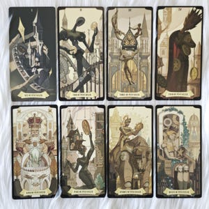 May include: Eight tarot cards from the suit of Pentacles arranged in two rows. The cards feature stylized illustrations of figures and architecture in shades of cream, brown, and black, with each card labeled at the bottom with its specific title.