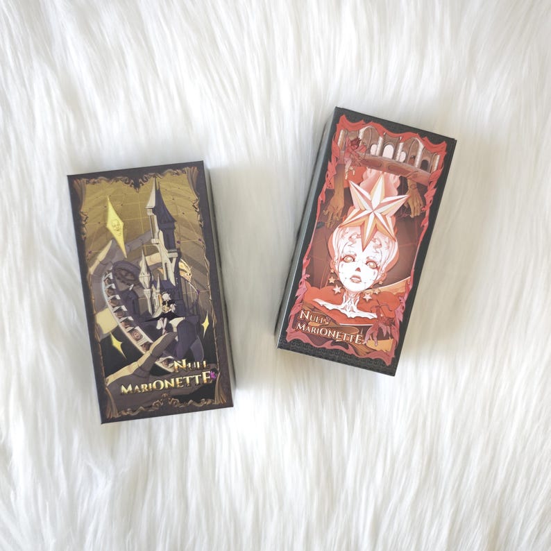 May include: Two rectangular boxes labeled Null Marionette. The left box features a dark castle illustration with gold accents. The right box displays a stylized character with a star-shaped headpiece, red tones, and an architectural archway background.