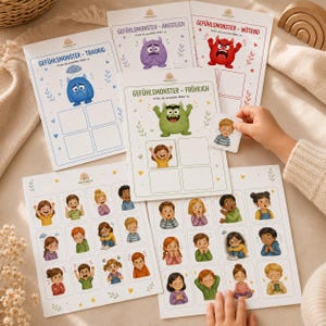 Puede incluir: Juego educativo con ilustraciones de emociones y tarjetas a juego. El juego incluye tarjetas con palabras alemanas como "TRAURIG" (triste), "ÄNGSTLICH" (ansioso) y "WÜTEND" (enfadado), junto con ilustraciones de niños.