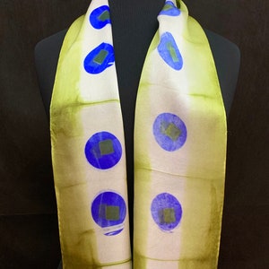 shibori dyed silk satin scarf in green gold and cobalt blue