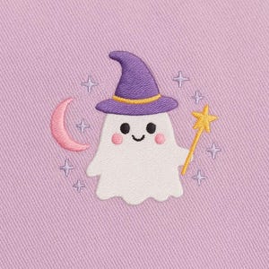 May include: Embroidered design of a friendly ghost wearing a purple witch hat with a yellow band. The ghost holds a yellow star wand, and a pink crescent moon and stars surround it on a lavender background.