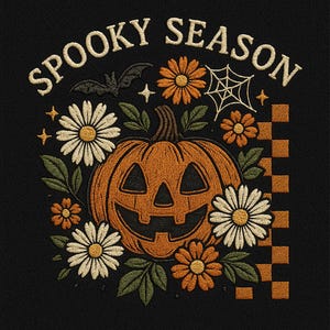 May include: Embroidered design with a grinning pumpkin, daisies, and orange flowers, with the words "Spooky Season" above. A bat, spiderweb, and stars complete the Halloween-themed design on a black background.