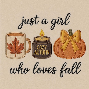 May include: An embroidered design featuring a mug with a maple leaf, a candle labeled "Cozy Autumn", and a pumpkin with a bow. The text reads "just a girl who loves fall". The design is in shades of brown, orange, and cream.