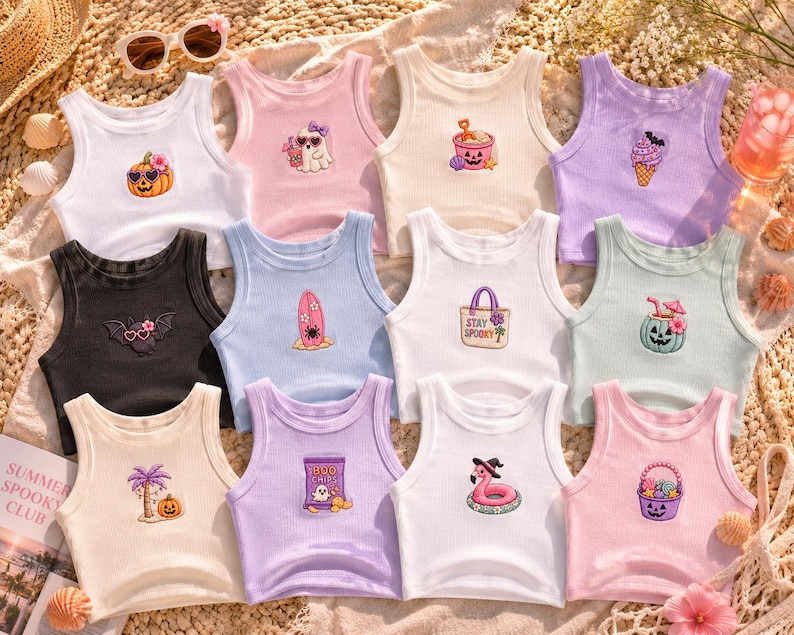 May include: A collection of ribbed tank tops in various colors, each featuring a unique embroidered design. Designs include a pumpkin with sunglasses, a bat with sunglasses, and a flamingo with a witch hat. The text "Summer Spooky Club" is visible.