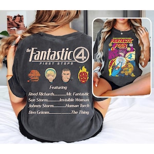 May include: Dark grey t-shirt with "The Fantastic Four" comic book design. The front shows a comic cover, and the back has the Fantastic Four logo, character illustrations, and character names.