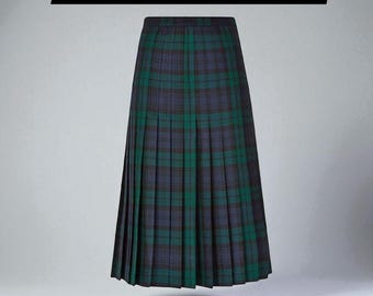 May include: A pleated, full-length skirt in a green and navy blue plaid pattern. The skirt has a high waist and falls to the ankles. The text "Handmadekiltoutfit" is displayed in a black rectangle at the top of the image.