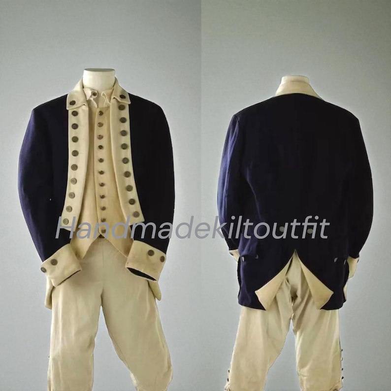 May include: A navy blue and cream-colored historical costume, including a jacket, vest, and pants. The jacket has cream-colored lapels and cuffs with decorative buttons. The pants are cream-colored. The outfit is displayed on a mannequin.
