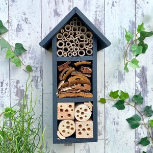 Beautifully handmade wildlife habitat, Bee Hotel, Insect House. Timber and painted in dark grey. Three tier.
Keyhole hanger provided.
Bamboo and drilled holes provide a perfect home for solitary bees.