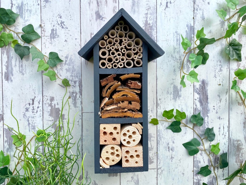 Beautifully handmade wildlife habitat, Bee Hotel, Insect House. Timber and painted in dark grey. Three tier.
Keyhole hanger provided.
Bamboo and drilled holes provide a perfect home for solitary bees.