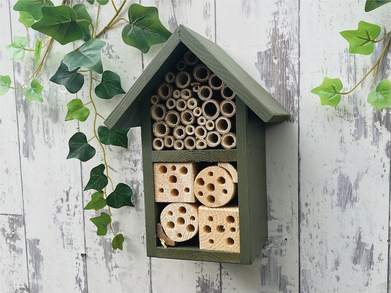 Beautifully handmade two tier wildlife habitat, Bee Hotel, Insect House. Timber and painted in Old English, dark green.
Keyhole hanger provided.
Bamboo, and drilled holes provide a perfect home for solitary bees.