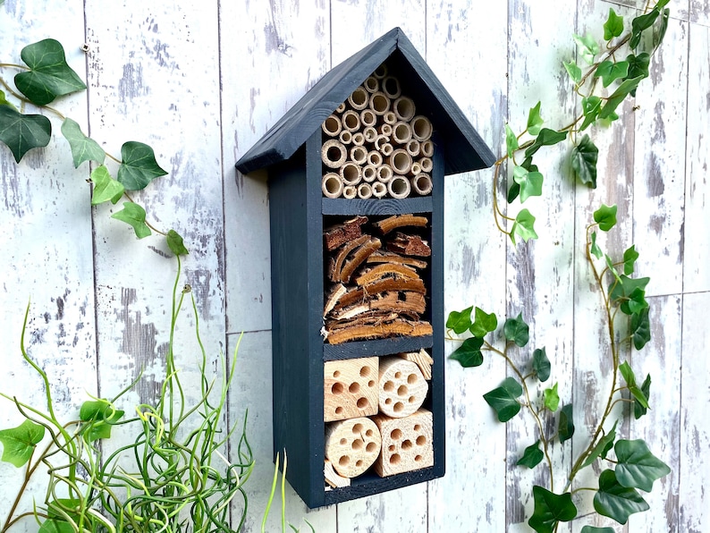 Beautifully handmade wildlife habitat, Bee Hotel, Insect House. Timber and painted in dark grey. Three tier.
Keyhole hanger provided.
Bamboo and drilled holes provide a perfect home for solitary bees.