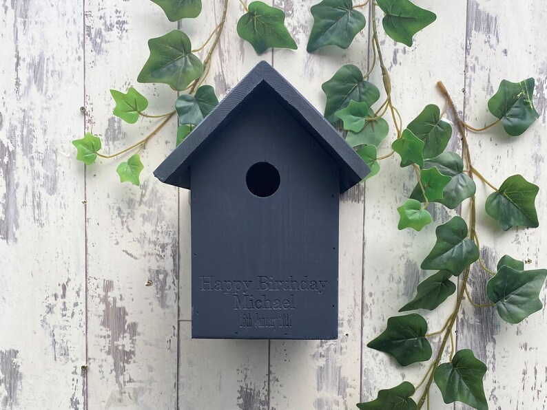 Handmade wooden Bird box in Urban Slate, dark grey. This one is engraved with a birthday message, why not add your own? 
Our bird boxes have a 28mm hole to allow a large range of birds to use.