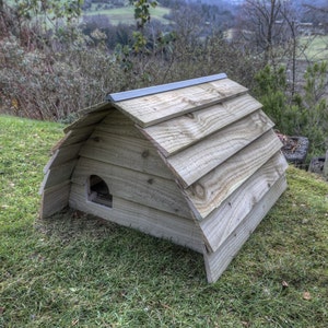Handmade wooden hedgehog house. Keeps them safe from cats, dogs and foxes.
The hedgehog house is aprox 65cm long, 55cm wide and 50cm high.
