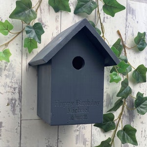 Handmade wooden Bird box in Urban Slate, dark grey. This one is engraved with a birthday message, why not add your own? 
Our bird boxes have a 28mm hole to allow a large range of birds to use.