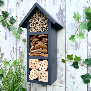 Beautifully handmade wildlife habitat, Bee Hotel, Insect House. Timber and painted in dark grey. Three tier.
Keyhole hanger provided.
Bamboo and drilled holes provide a perfect home for solitary bees.