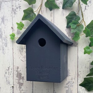 Handmade wooden Bird box in Urban Slate, dark grey. This one is engraved with a birthday message, why not add your own? 
Our bird boxes have a 28mm hole to allow a large range of birds to use.