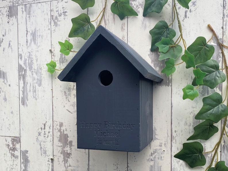 Handmade wooden Bird box in Urban Slate, dark grey. This one is engraved with a birthday message, why not add your own? 
Our bird boxes have a 28mm hole to allow a large range of birds to use.