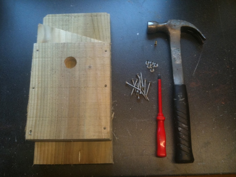 Put together in 10-15 minutes. Kit includes: 6 pieces of timber, roofing felt, screw, nails and an instruction sheet.