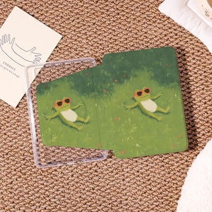 May include: A set of three ceramic mugs with a speckled, matte finish. The mugs are in shades of cream, light grey, and dark grey. Each mug has a simple, minimalist design, ideal for coffee or tea.