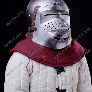 Warrior wearing handcrafted houndskull bascinet steel helmet