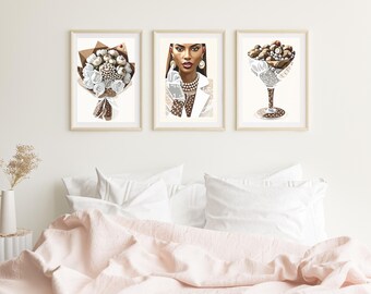 May include: Three framed illustrations in a minimalist style. The first illustration shows a bouquet of white flowers with brown stems. The second illustration shows a woman with dark skin wearing a white dress with black polka dots and a pearl necklace. The third illustration shows a glass filled with brown and white candies.