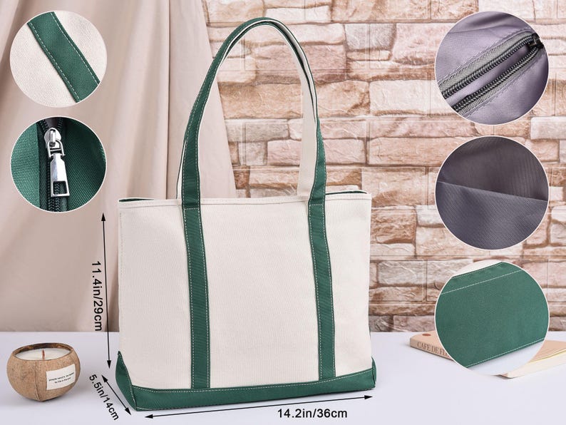 May include: A white canvas tote bag with green detailing. The bag features green trim and handles. It measures 36cm wide, 29cm high, and 14cm deep. The bag has a zip closure and a lined interior. Ideal for everyday use.