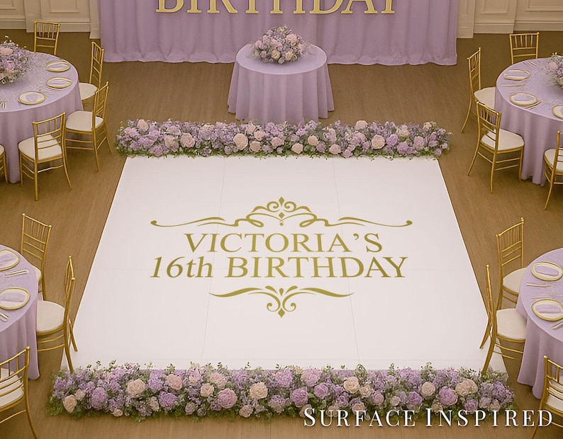 May include: A party venue decorated for a 16th birthday celebration. The white dance floor features gold text that reads "Victoria's 16th Birthday." Tables are draped in lavender linens and surrounded by gold chairs. Floral arrangements and a backdrop complete the festive scene.